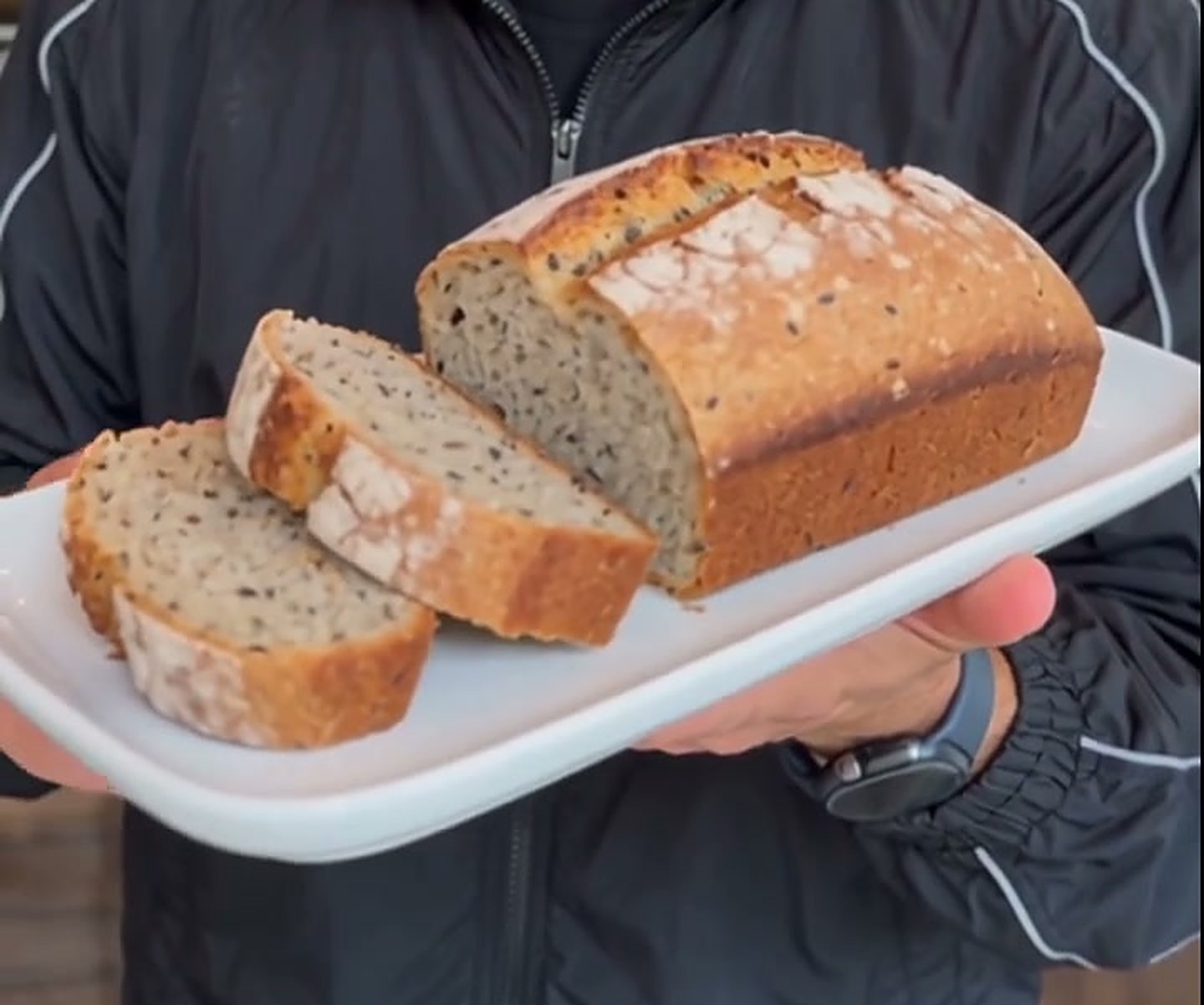 A sliced loaf of seed bread